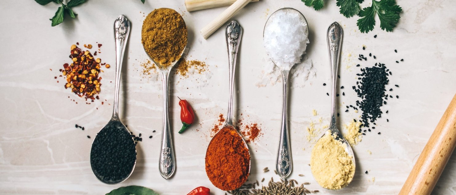 picture of spices like black and cayenne pepper